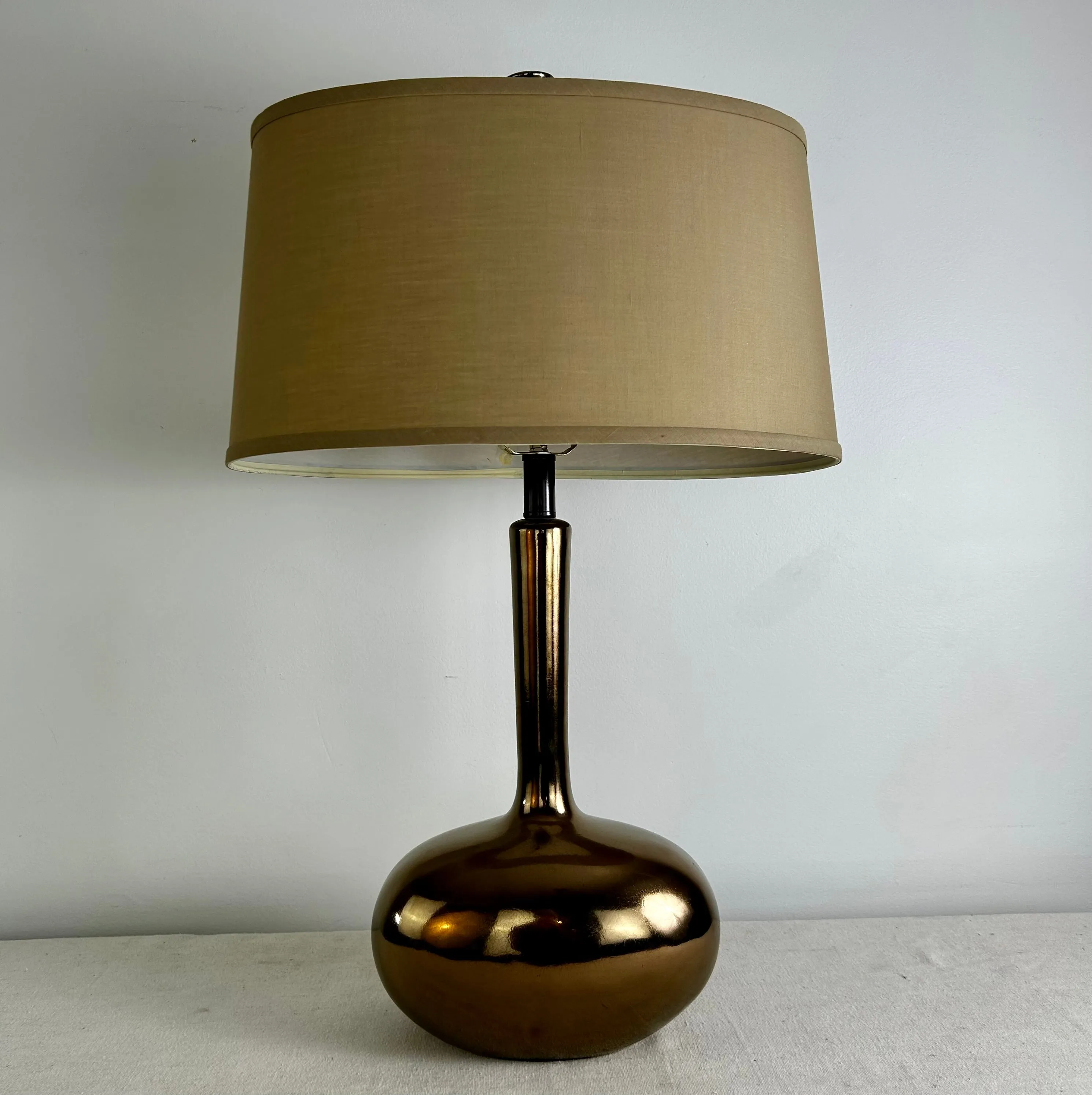 Glossy Bronze Ceramic Table lamp with Beige Ovular Shade